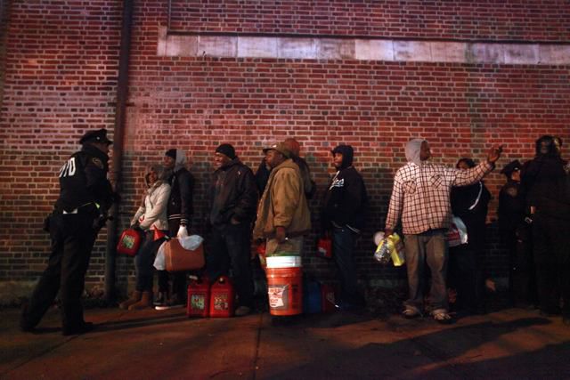 Crowds wait for free gas November 3, 2012 at the Bedford Avenue Armory